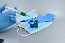 Three women sitting and smiling.